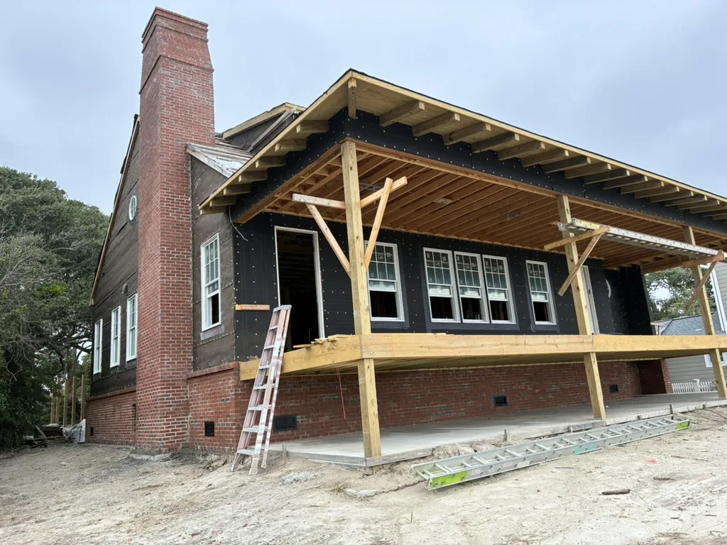 Wide view of chimney and exterior masonry during a new-construction project